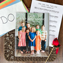 Load image into Gallery viewer, flat lay image of spiral bound Step Into Singing curriculum