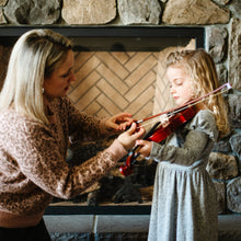 Load image into Gallery viewer, woman teaching a young girl with blond hair how to play the violin 
